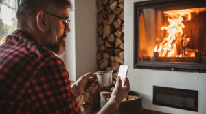 Switch energy suppliers man fireplace phone
